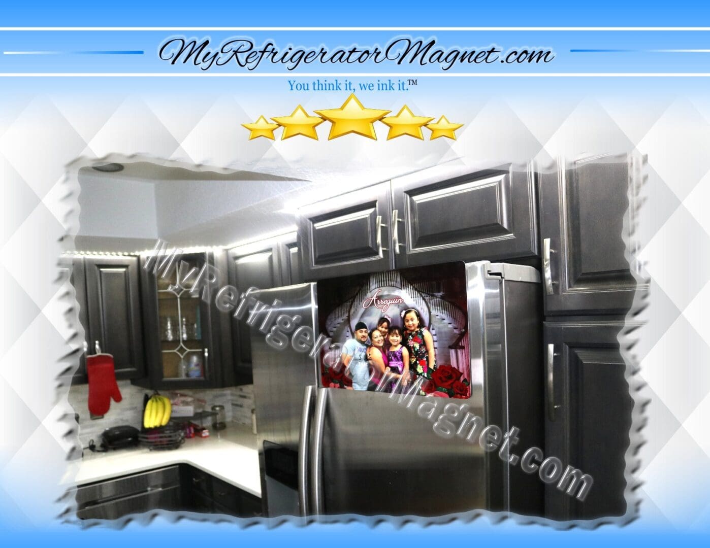 A kitchen with stainless steel appliances and a picture of the three kids.
